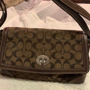Coach purse with straps that adjust all the way to a crossbody.